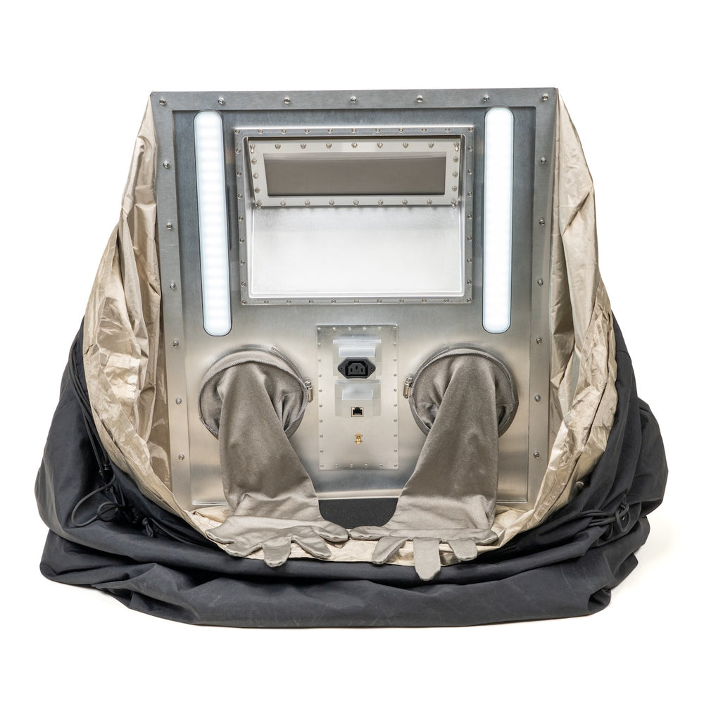 Interior of the Rapid Cinch showing LED light bars, viewing window, filter, and conductive gloves