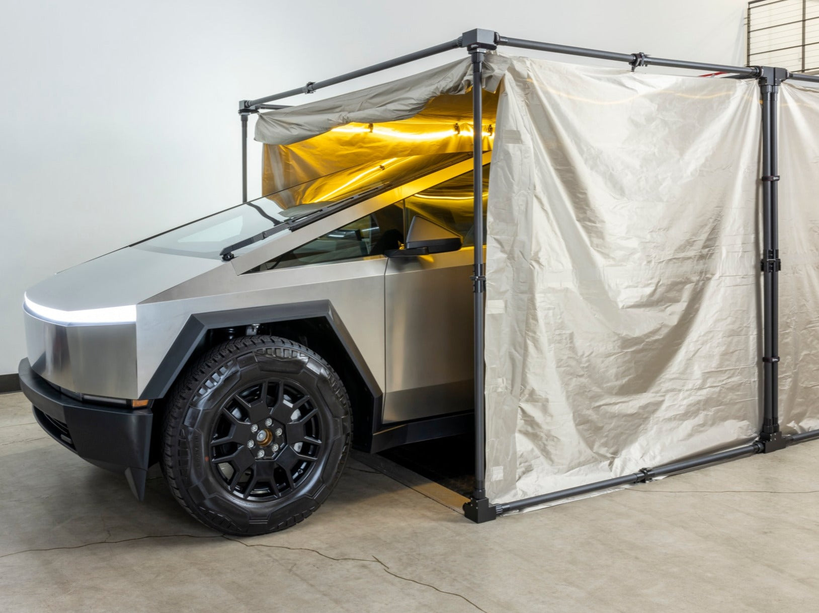 CYPHERCYLENT EMP Faraday Car Cover shielding a vehicle