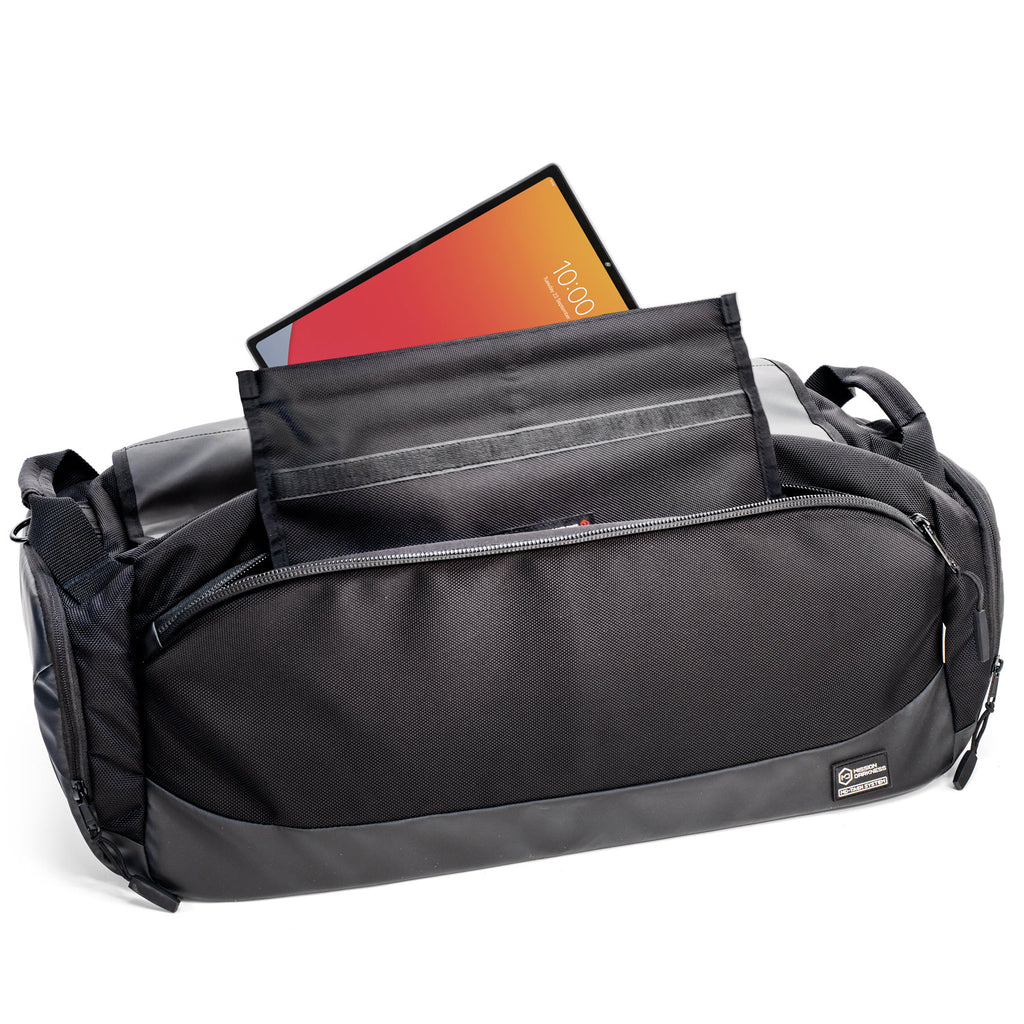 Device sliding into the open central Faraday compartment of the Disconnect Duffel